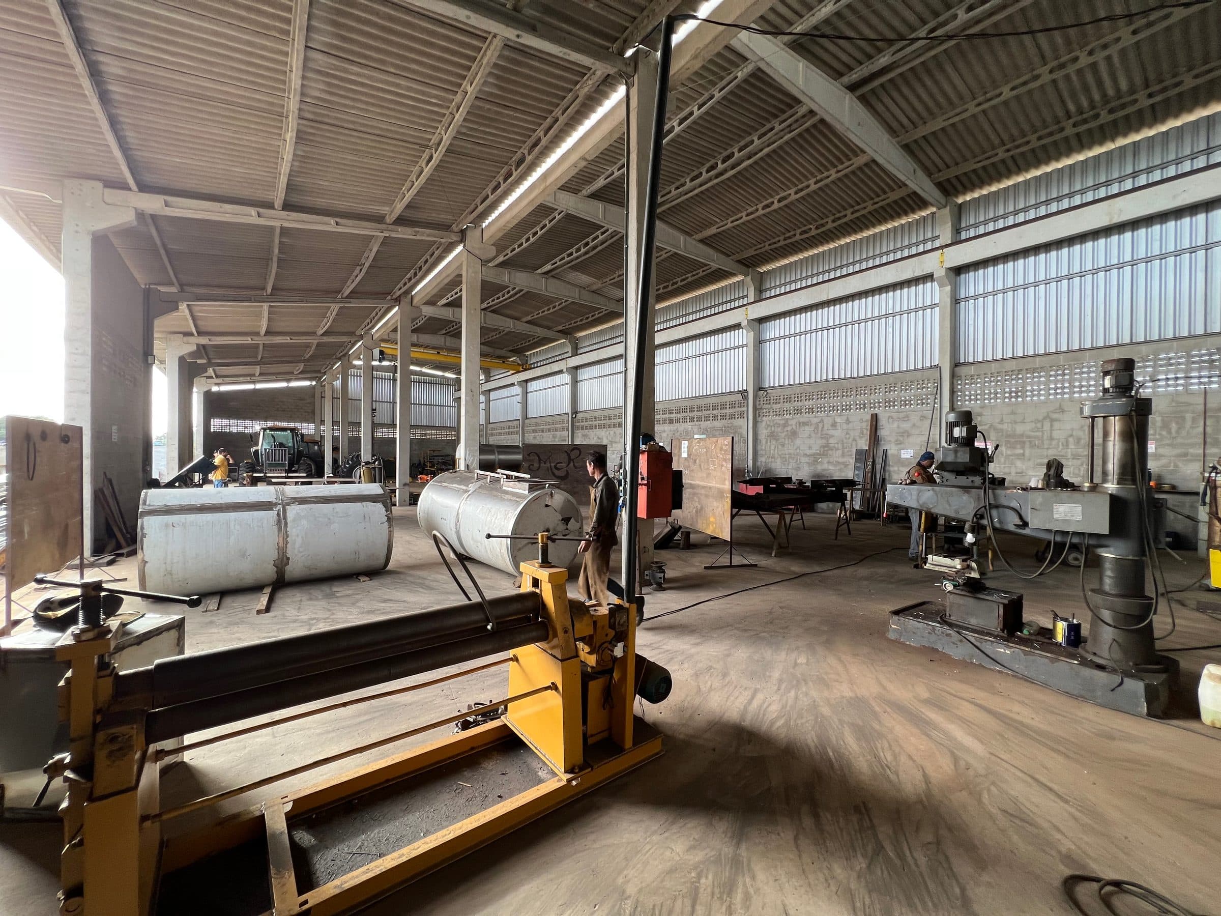 Emflora manufacturing shed, with lathes, a press and irrigation tanks in production